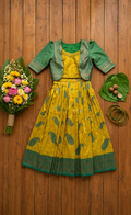 A yellow and green traditional Indian outfit ,featuring a yellow skirt with green paisley motifs, a green blouse, and a matching green jacket. Kids Indian ethnic wear Australia full dress