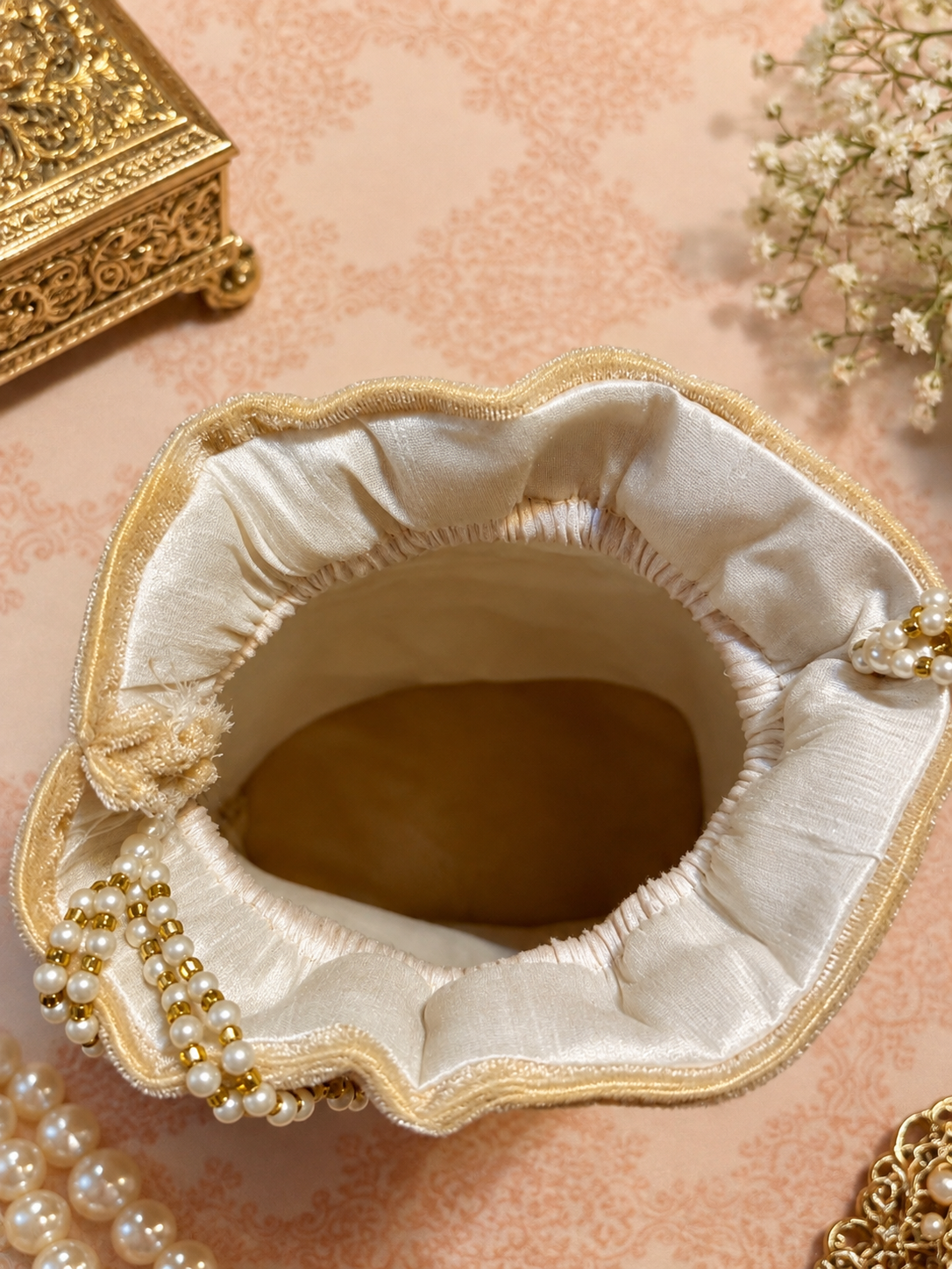 Embellished potli bag golden